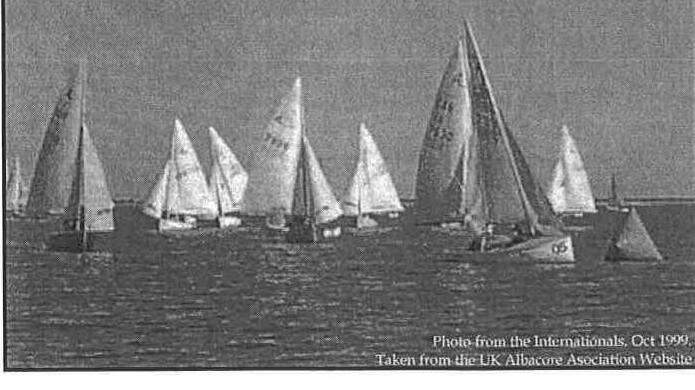 A fleet of Albacore dinghies racing, photo from the 1999 Internationals