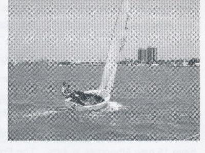 Boat sailing with Hamilton skyline in background