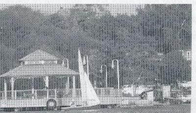 Clubhouse gazebo with a boat sailing past