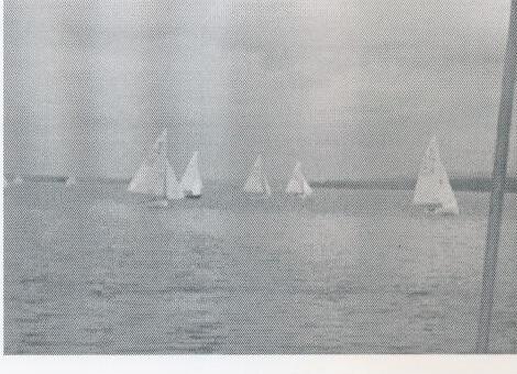 Albacore fleet racing on the water, several boats visible