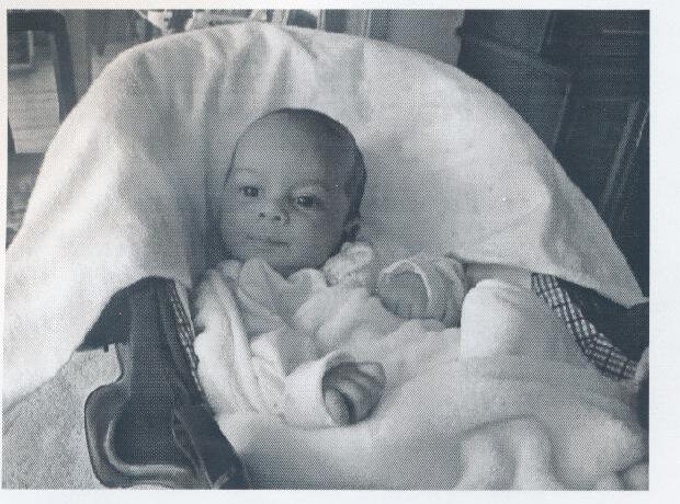 Baby Cristiano Monteiro wrapped in a blanket