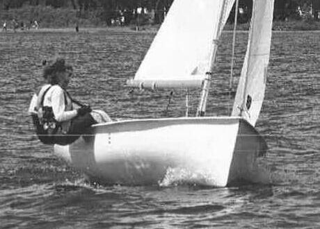 Teresa Miolla hiking out and steering an Albacore
